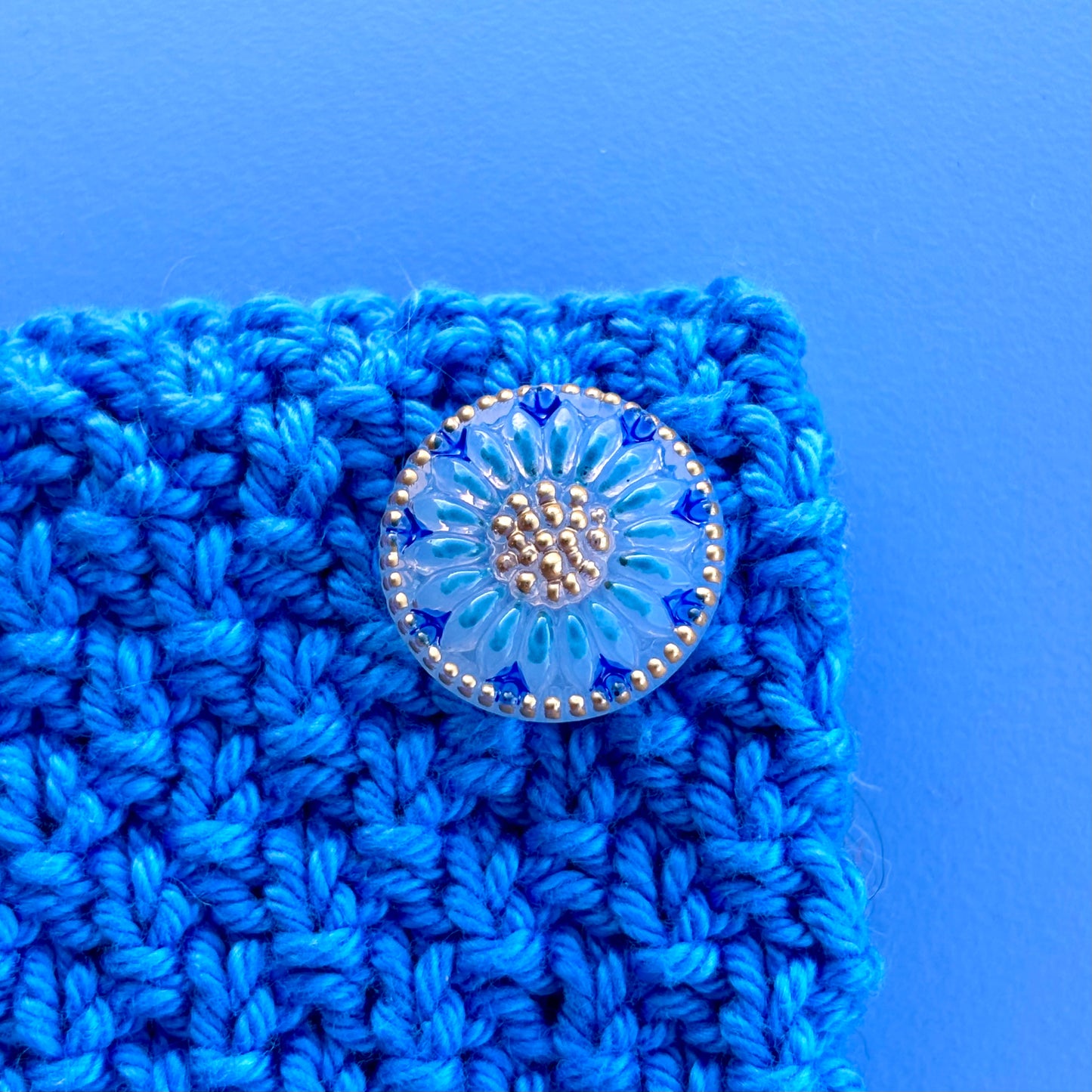 glasknap solsikke 18mm blå guld