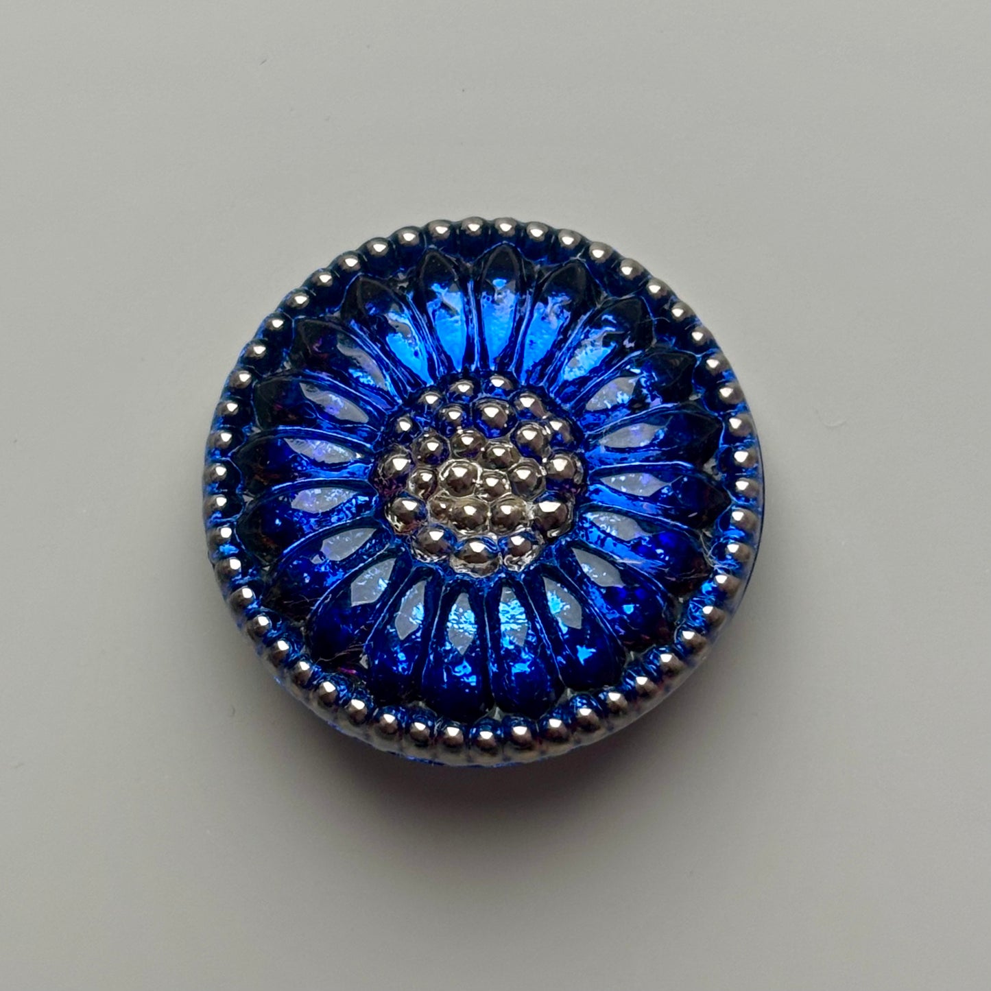 solsikke glasknap 22mm blå sølv
