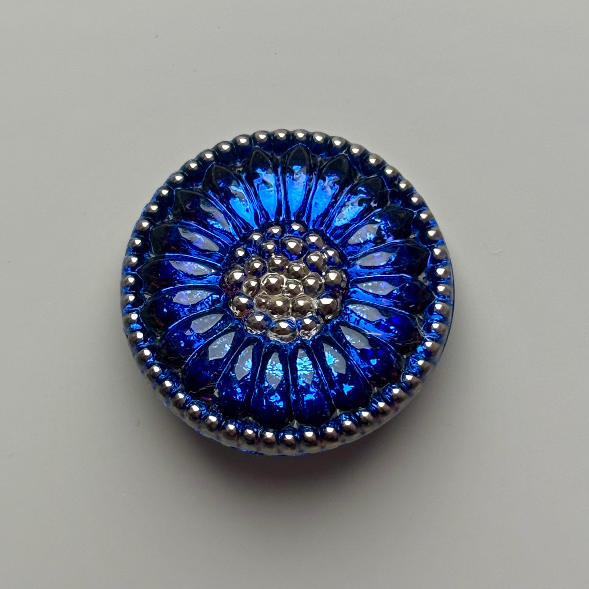 solsikke glasknap 22mm blå sølv 